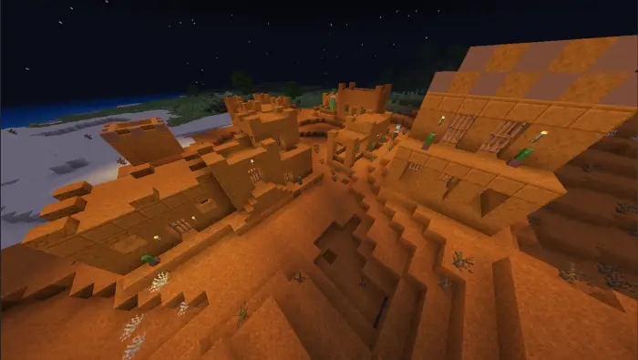 Orange mesa village buildings at night