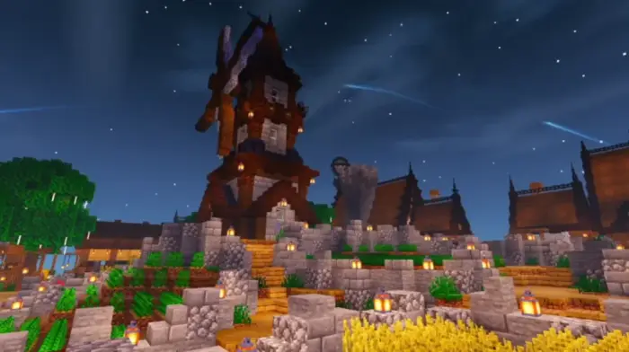 Rustic windmill and village at night