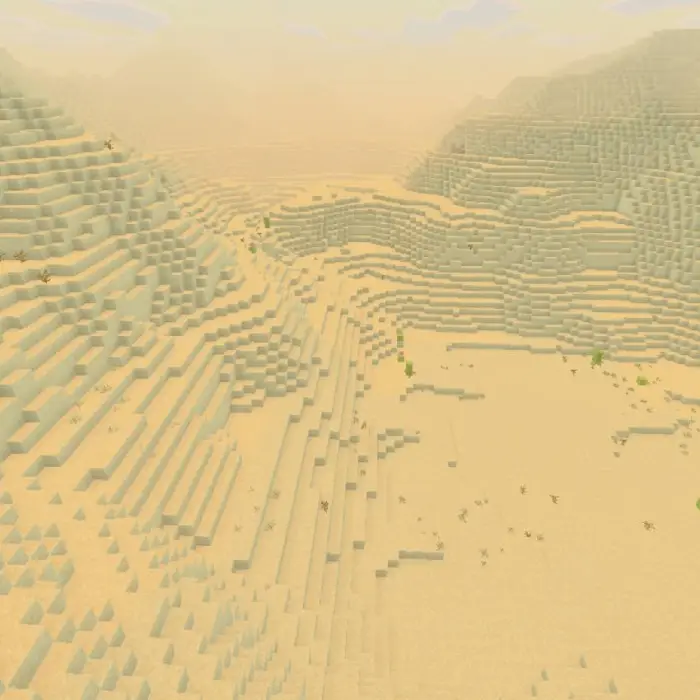 Blocky desert landscape with sandy hills.
