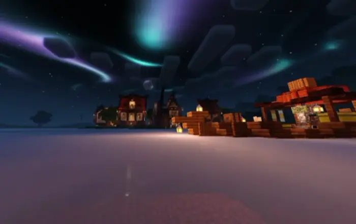 Colorful night sky with glowing village lights