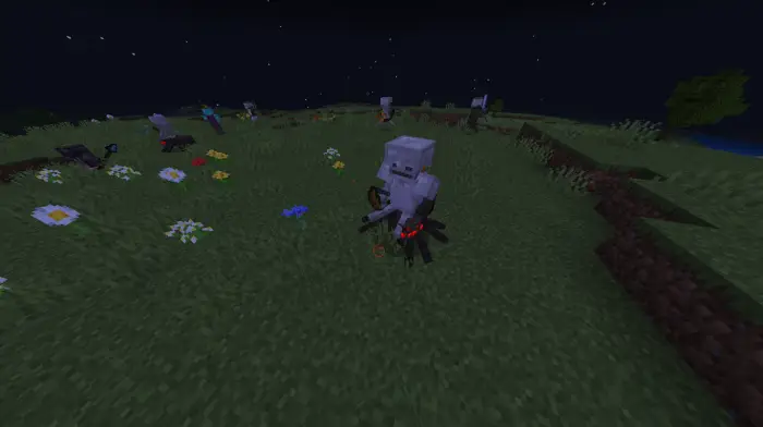 Skeletons and spiders gather on grassy field.