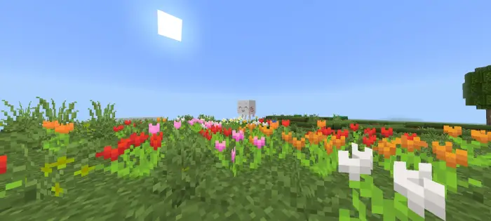 Colorful flower field with distant creature