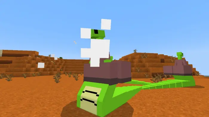 Blocky green serpent deity in desert terrain
