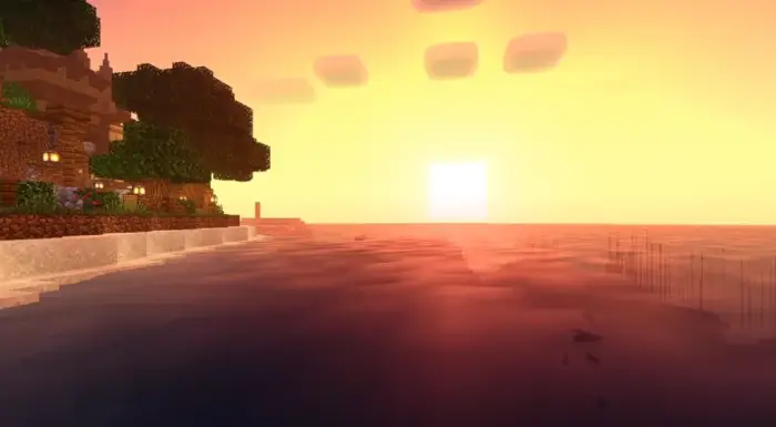 Vivid sunset lighting over calm water and shore