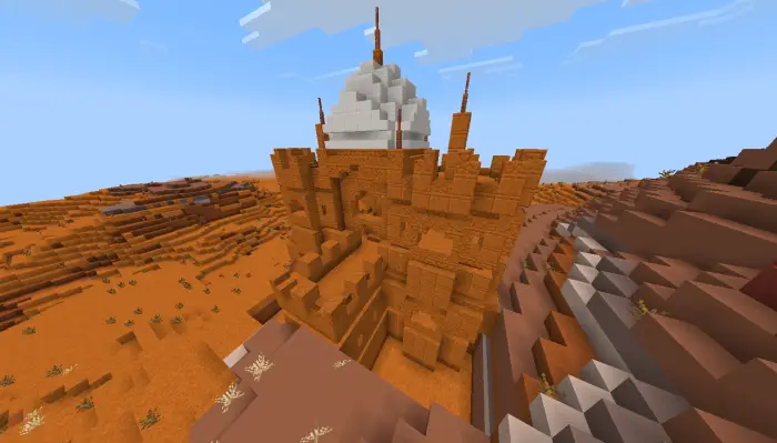 Desert castle built into red mesa cliffs