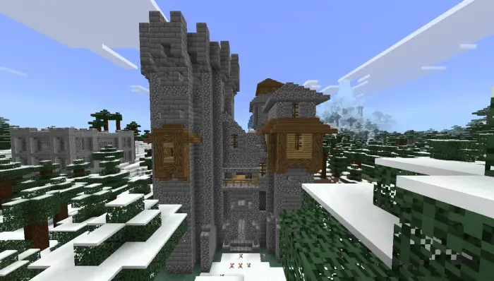 Snowy stone fortress among pine trees