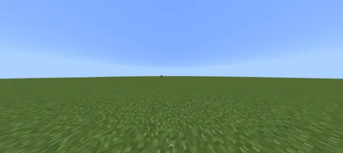 Flat grassy landscape under a clear sky