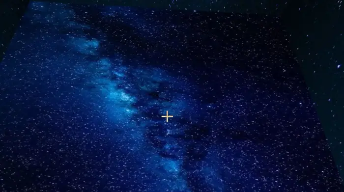 Starry night sky texture with blue nebula