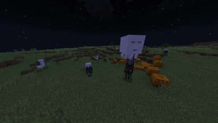 Hostile mobs gather on a grassy field at night