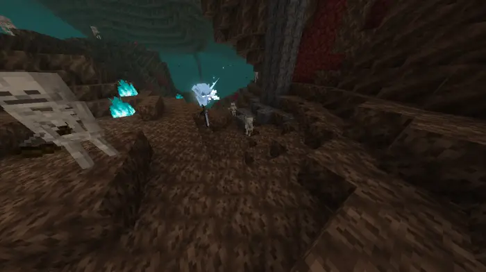 Skeleton mobs and soul fire in a dark cave