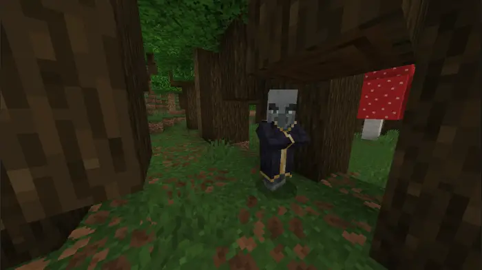 Evoker mob standing in a forest biome