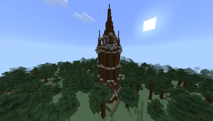 Tall wooden tower rises above dense forest.