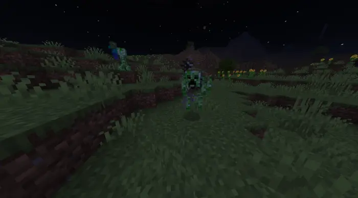 Fused creeper-spider mob at night