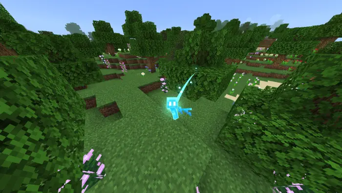 Glowing blue mob in a lush forest biome