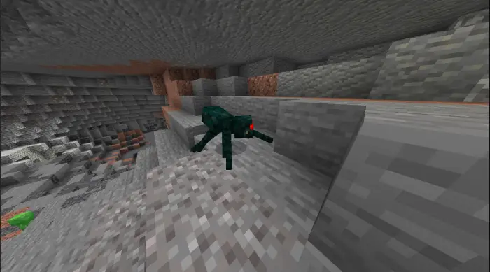 Cave spider with red eyes in a stone cave