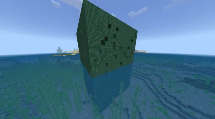 Large green underwater structure in the ocean