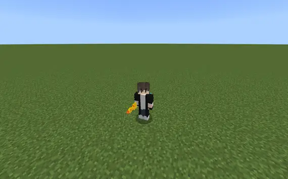 Player holding a silly sound item on grass.