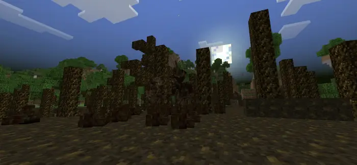 Corrupted, decayed trees under a dark sky