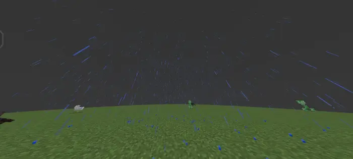 Heavy rain falling on a grassy plain