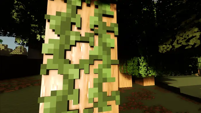 Sunlit pixelated tree trunk with green vines