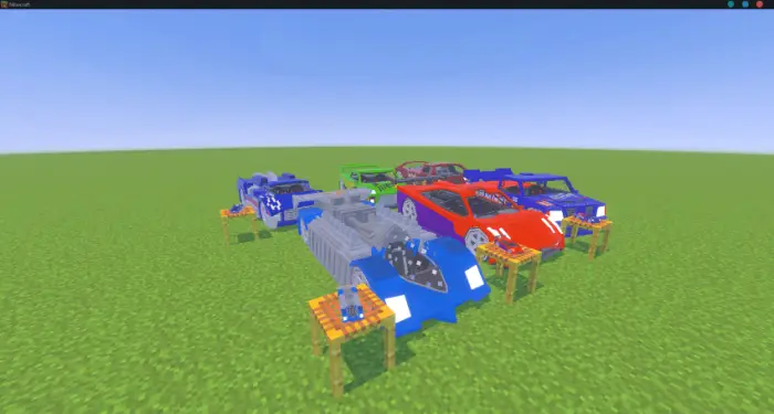 Toy-style race cars grouped on grassy field