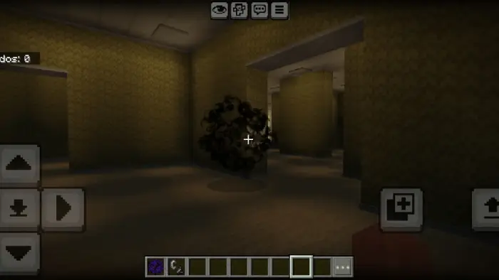 Maze-like yellow halls with a dark entity ahead