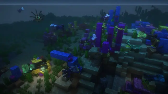 Colorful squids swimming in a vibrant ocean.