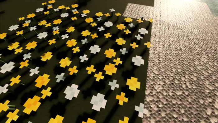 Yellow and white pixel flowers near textured sand