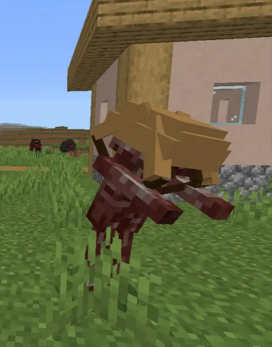 Blocky headcrab creature in grassy village