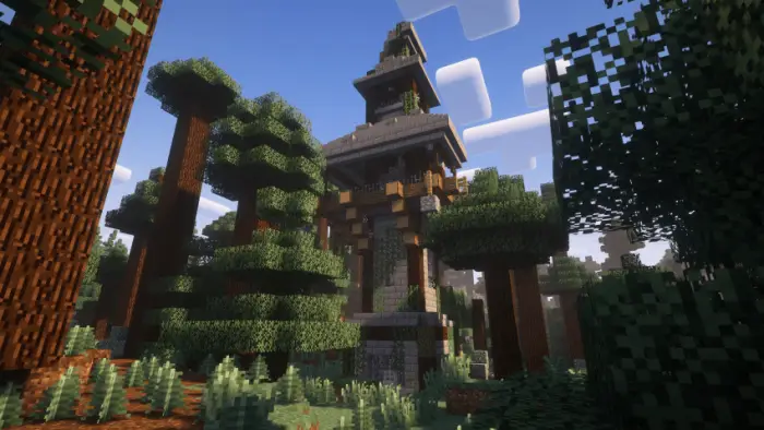 Tall stone tower surrounded by dense forest