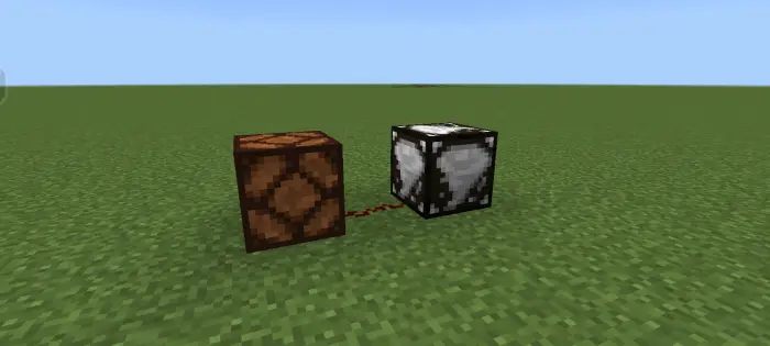 Two connected weather sensor blocks on grass