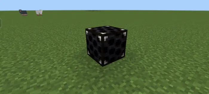 Black weather sensor block on grass field