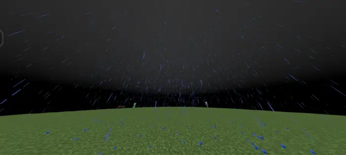 Heavy rain falling on grassy terrain