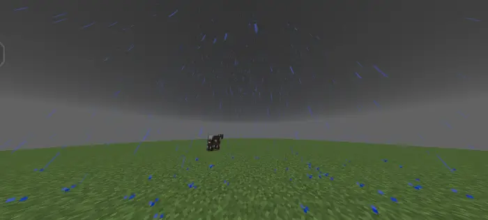 Heavy rain falling on grassy terrain