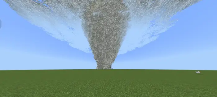 Large tornado forming over grassy plain