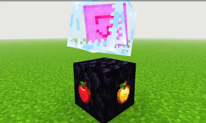 Block with apple textures on grass field