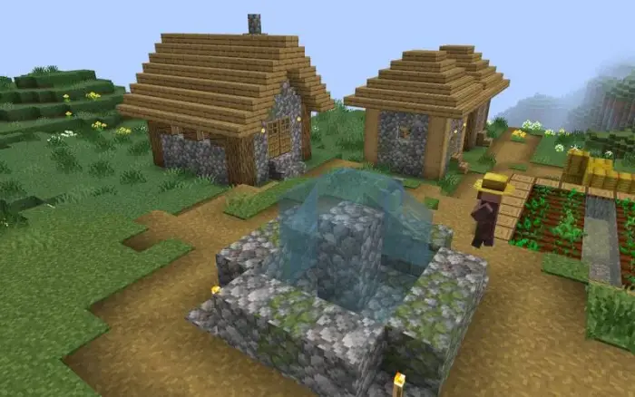 Colorful cobblestone village with well