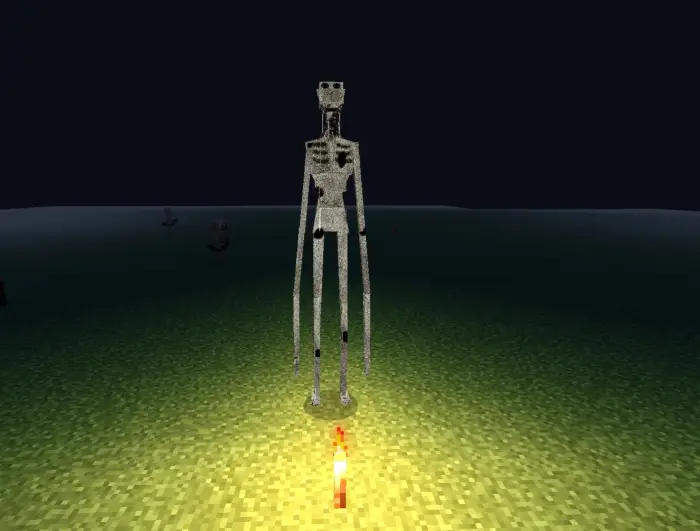 Tall, pale monster standing in the dark.