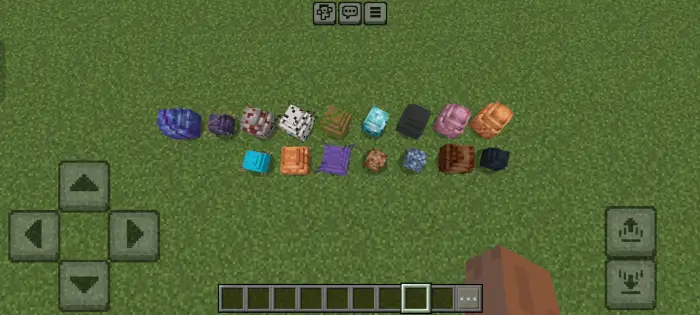 Various dragon saddles and rider gear on grass