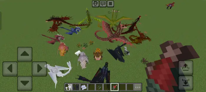 Multiple colorful dragons on grassy terrain