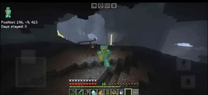 Player in armor explores a dark cave.
