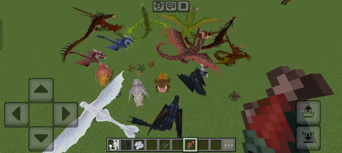 Multiple colorful dragons on a grassy field