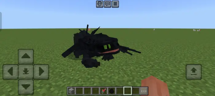 Night Fury dragon with green eyes on grass