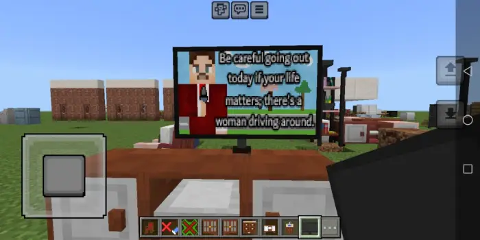 TV on a wooden stand in a blocky world