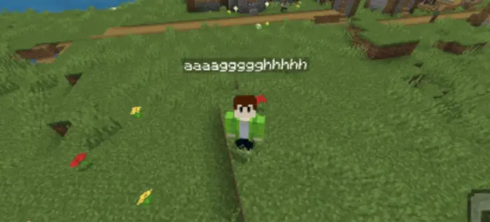 Player with chat bubble overhead on grass