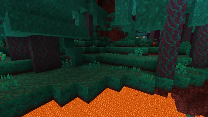 Lush grass blocks above bright lava pool