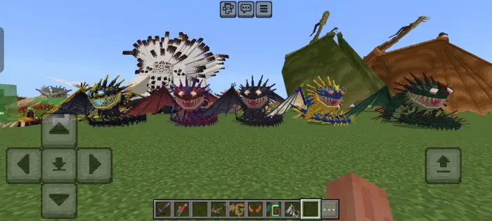 Six colorful dragons lined up on grass.