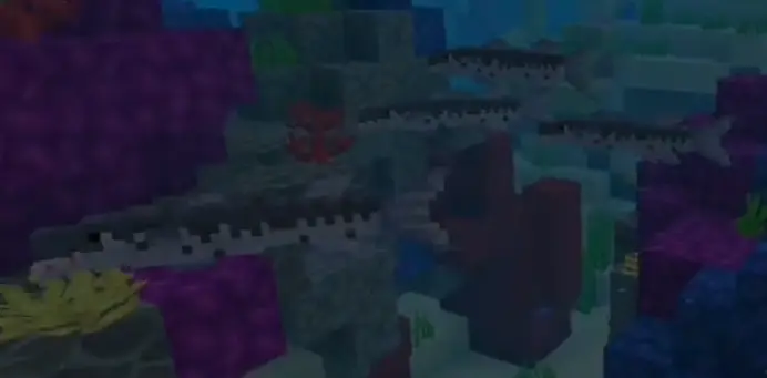 Pixelated barracudas swimming in coral reef