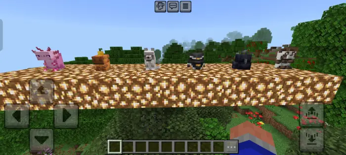 Six colorful animal mobs on a glowing platform.