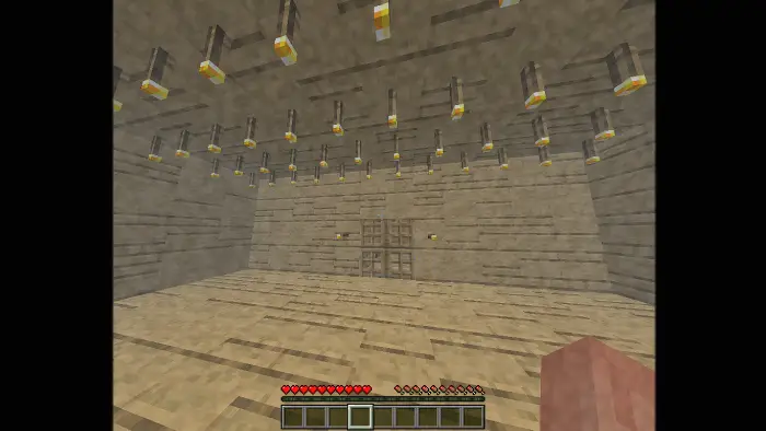 Dimly lit, empty wooden room with doors